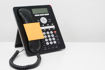 isolated mock up sticky note on IP phone