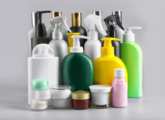 Set of body care products on grey background