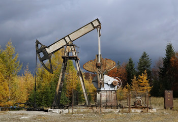 Fototapeta na wymiar old oil pump in the Carpathian Mountains
