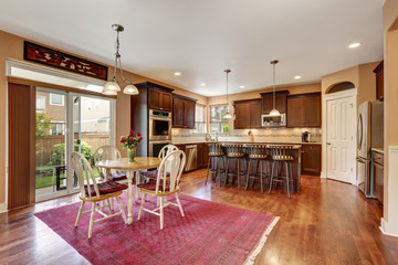 Cozy kitchen and dining room interior with hardwood floor