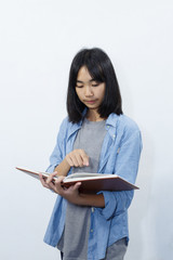 asian cute girl reading a book