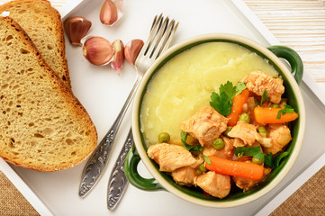 Turkey goulash stewed with vegetables and mashed potatoes. 