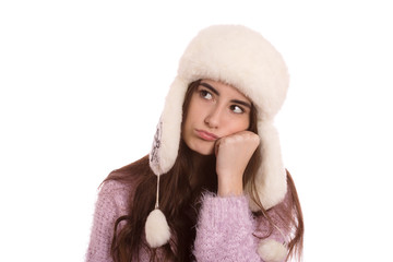 fun serious girl thinker in winter hat isolated on white background