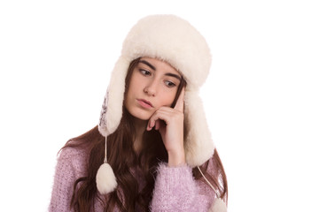 serious girl thinker in winter hat isolated on white background