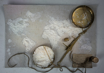 wheat flour in the form of a world map. Food, scales vintage. top view. overhead horizontal.
