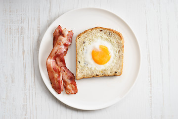 egg in a hole and crispy bacon