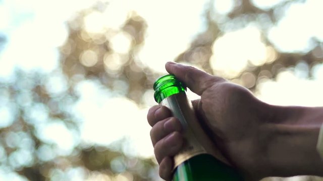 Cork flying out of bottle of champagne. Video. 4k. Slow motion. Shampain. Shampage. Wine. 