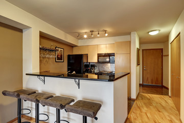 Small kitchen room in black and beige tones
