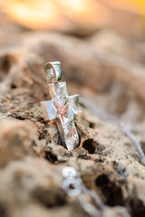 Golden cross on rock