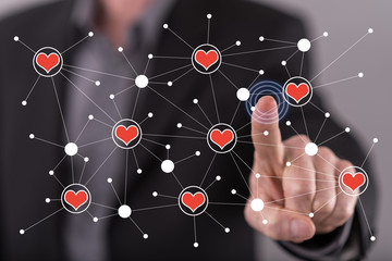 Man touching a virtual social network on a touch screen