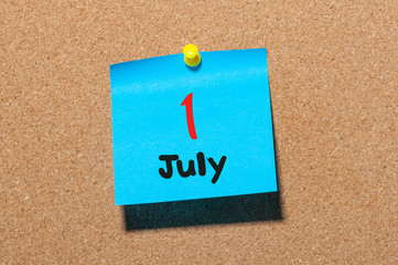 July 11st. Day 1 of month, color sticker calendar on notice board. Summer time. Close up