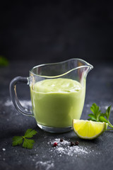 avocado salad dressing. Creamy avocado sauce in glass.