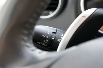 Switch for automatic headlights in car.