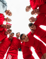 Kids soccer team in huddle