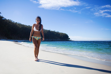 young woman walking in the beach