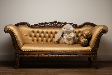 Easter bunny on gold sofa