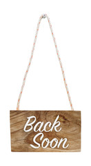 Back soon on hanging wooden sign, isolated, with clipping path