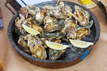 Plenty of seafood, oysters on grill pan