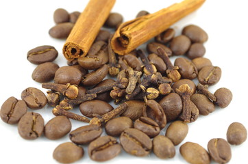 roasted coffee cinnamon and cloves  on white background