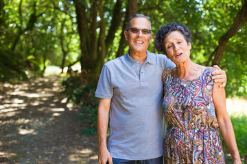 Naklejka premium middle aged couple walking in the forest