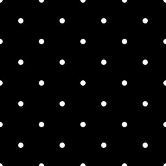 Seamless polka dot pattern. White dots on black background. Vector illustration.