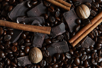 roasted coffee beans with chocolate nutmeg  cinnamon close up