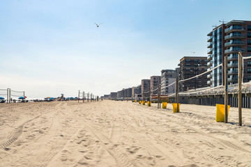 Long beach at the evening. Summer weather, splittoned image