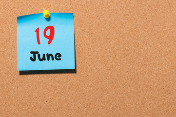 June 19th. Day 19 of month, color sticker calendar on notice board. Summer time. Empty space for text