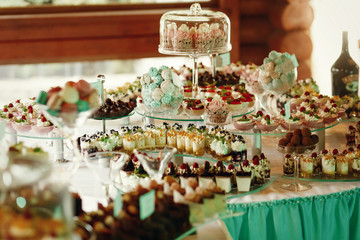 Tasty sweets, chocolates and other delicious stuff stand on the