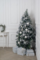 Christmas and New Year decorated interior room with presents and New year tree
