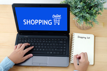 Shopping online device on labtop screen and blank shopping lists