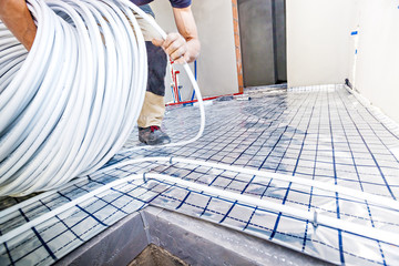 Pipe fitter mounted underfloor heating. Heating system and underfloor heating.