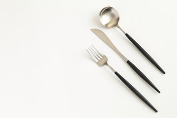 Knife, spoon and fork isolated on white background