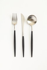 Knife, spoon and fork isolated on white background