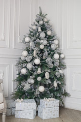 Christmas and New Year decorated interior room with presents and New year tree