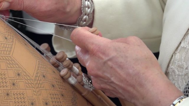 old hands making tatting