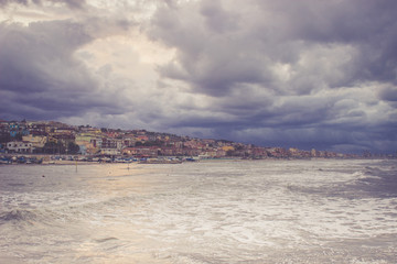 Beautiful landscape of the coast with dramatic sky and uncalm se