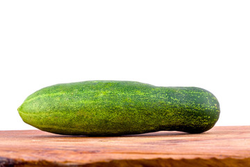 fresh green cucumbers on wooden background healthy raw vegetable food isolated
