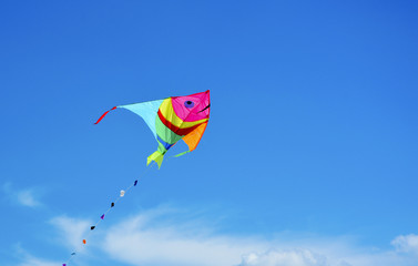 Colorful kite over blue sky