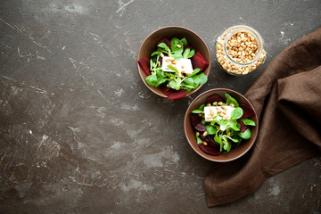Corn salad with beetroot, feta cheese and decorated with nuts
