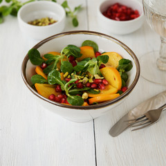 Fresh corn salad with persimmon and pomegranate 

