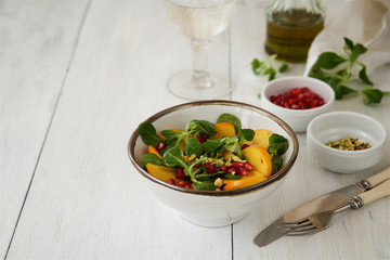 Fresh corn salad with persimmon and pomegranate 
