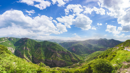 Beautiful landscape with green mountains and magnificent cloudy sky. Exploring Armenia