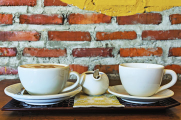 Cups of coffee  on old wooden background