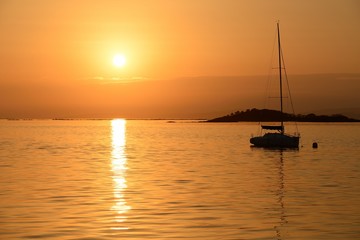 sailing yacht on the background of sunset