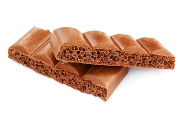 Two pieces of porous bubble chocolate