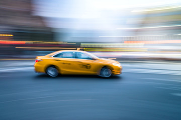Obraz na płótnie Canvas NYC taxi in motion. Blurred, long exposure images.