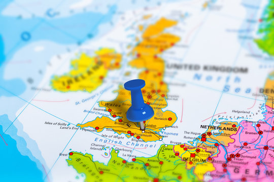 Fototapeta London in United Kingdom pinned on colorful political map of Europe. Geopolitical school atlas. Tilt shift effect.