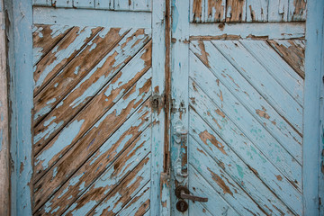 beautiful background and texture green-blue door at sidewalk, old town.