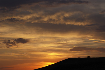 Russia. Khakassia. Western Sayan. Mountains and hills. Sunset.